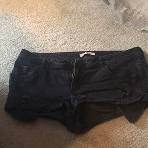 Ripped jean shorts with no wear on them.